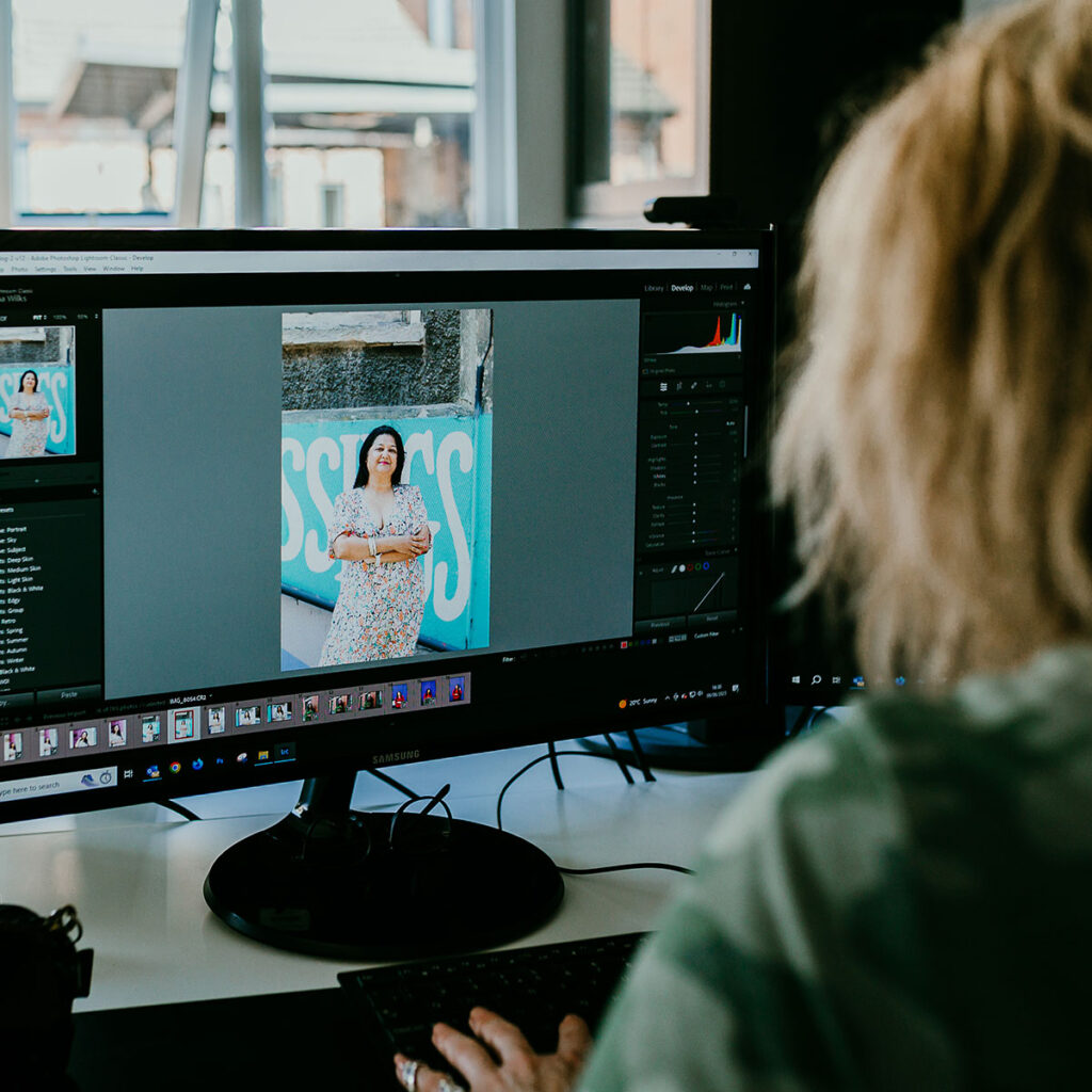 Headshot & Brand Photographer, Gemma Wilks, editing photos in her studio
