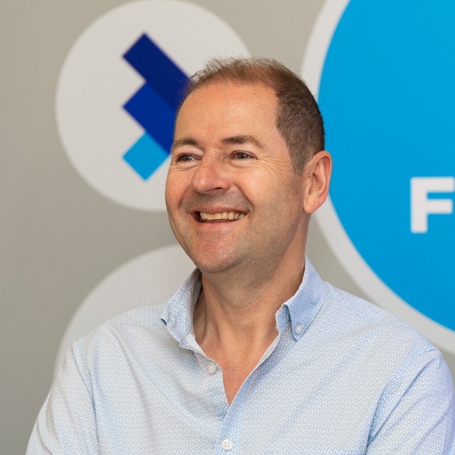 Team Photos for FDPack - Fractional Finance Services in Southwell - headshot in front of branded signage