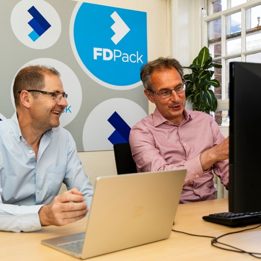 Team Photos for FDPack - Fractional Finance Services in Southwell - the team working together on a laptop and computer