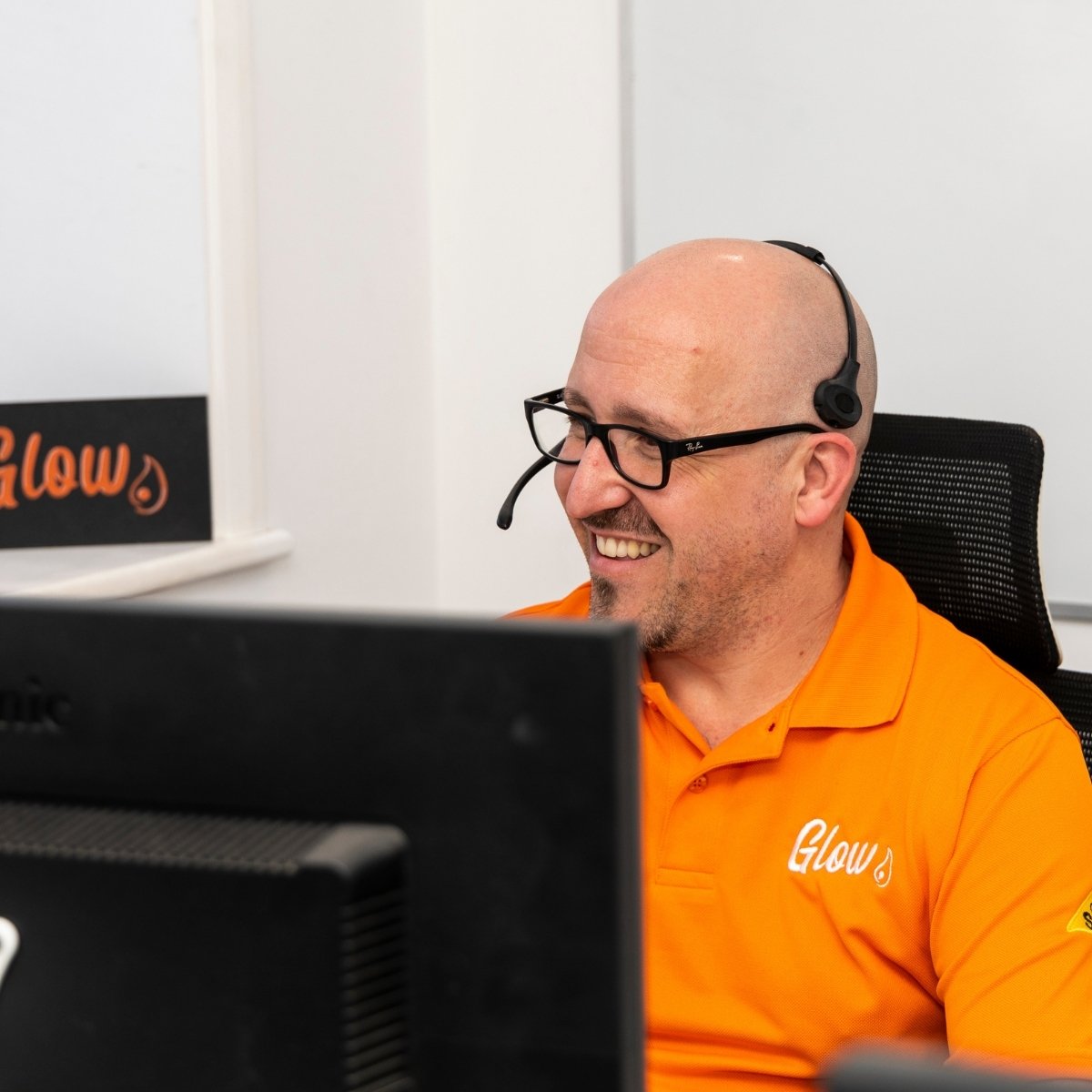 Team photos for The Glow Group, Lincolnshire - a customer service assistant on the phone