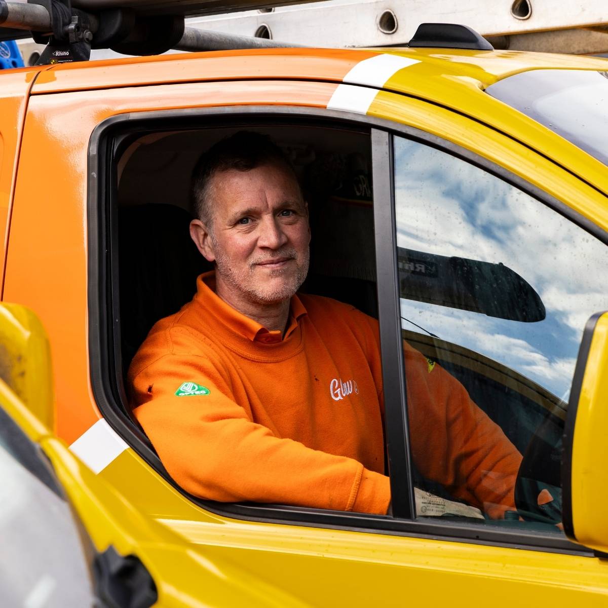 Team photos for The Glow Group, Lincolnshire - headshot through a branded van window