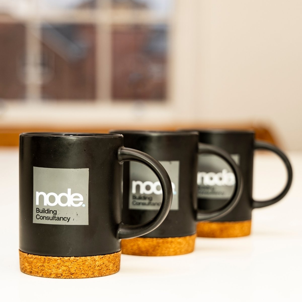 Team Photos with Node Building Consultancy, Nottingham - three branded mugs